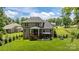 Beautiful backyard with a patio, screened porch, and manicured landscaping at 322 Ethan Ln, Rock Hill, SC 29732