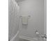Clean bathroom featuring a shower with a white curtain and neatly folded towel on a towel rack at 322 Ethan Ln, Rock Hill, SC 29732
