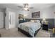 Bright bedroom with wainscoting, plush carpet, and a comfortable bed with stylish linens at 322 Ethan Ln, Rock Hill, SC 29732