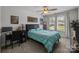 Bedroom featuring a ceiling fan, large windows and a small desk with computer at 322 Ethan Ln, Rock Hill, SC 29732