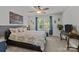 Inviting bedroom featuring a ceiling fan, cozy carpet, and large windows with decorative curtains at 322 Ethan Ln, Rock Hill, SC 29732