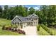 Stately two-story home with brick facade, well-manicured landscaping, and a spacious three-car driveway at 322 Ethan Ln, Rock Hill, SC 29732