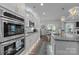 Modern kitchen equipped with stainless steel appliances, ample cabinet space, and an open layout dining area at 322 Ethan Ln, Rock Hill, SC 29732
