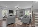 Spacious living room with a fireplace and large windows for plenty of natural light at 322 Ethan Ln, Rock Hill, SC 29732