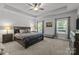 Large main bedroom with tray ceilings, plush carpet, and decorative accents at 322 Ethan Ln, Rock Hill, SC 29732
