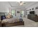 Comfortable main bedroom featuring a large bed, tray ceilings and ambient lighting at 322 Ethan Ln, Rock Hill, SC 29732