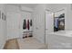Convenient mud room with bench, storage, coat hooks, and access to the laundry room at 322 Ethan Ln, Rock Hill, SC 29732