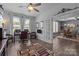Bright home office featuring hardwood floors, a ceiling fan, a large desk, and lots of natural light at 322 Ethan Ln, Rock Hill, SC 29732
