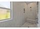 Tiled walk-in shower with a rainfall showerhead and built-in niche at 322 Ethan Ln, Rock Hill, SC 29732