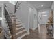 Elegant staircase with wooden steps, decorative railing, and natural light, leading to upper level at 322 Ethan Ln, Rock Hill, SC 29732