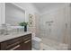 Modern bathroom featuring a glass shower, sleek vanity, and contemporary fixtures and stylish decor at 3304 Mar Vista Cir, Charlotte, NC 28209