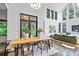 Elegant dining room with modern table and chairs, flowing into the living area at 3304 Mar Vista Cir, Charlotte, NC 28209