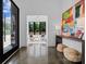 Bright foyer with polished floors, modern art, and a view into a sitting room at 3304 Mar Vista Cir, Charlotte, NC 28209