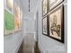Hallway features modern art and a sleek design with neutral colors at 3304 Mar Vista Cir, Charlotte, NC 28209