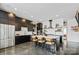 Bright kitchen with stainless steel appliances, a large island with seating, and dark cabinetry at 3304 Mar Vista Cir, Charlotte, NC 28209