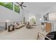 Bright living room with high ceilings, modern furnishings, and large windows offering natural light and serene views at 3304 Mar Vista Cir, Charlotte, NC 28209