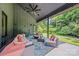 A covered patio offers a peaceful retreat with outdoor seating and views of the lush greenery at 3304 Mar Vista Cir, Charlotte, NC 28209