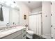 Bathroom showcasing a marble countertop vanity and a shower with a patterned curtain at 3741 9Th Street Ne Ct, Hickory, NC 28601