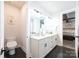 Bathroom featuring double sink vanity and toilet with door open to bedroom at 3741 9Th Street Ne Ct, Hickory, NC 28601