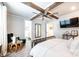 Bedroom boasting a wooden beam ceiling with a ceiling fan and a light-filled window at 3741 9Th Street Ne Ct, Hickory, NC 28601