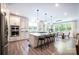 Open-concept kitchen with large island, stainless appliances, and dining area with ample natural light at 3741 9Th Street Ne Ct, Hickory, NC 28601