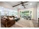 Spacious living room with natural light, wood beam ceiling, and easy access to the outdoor patio at 3741 9Th Street Ne Ct, Hickory, NC 28601