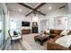 Bright living room with a fireplace, wooden beams, and comfortable seating arrangement at 3741 9Th Street Ne Ct, Hickory, NC 28601
