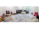 Playroom with an area rug, gray sectional sofa, and a window at 3741 9Th Street Ne Ct, Hickory, NC 28601
