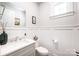 Tastefully decorated powder room with wainscoting and a modern vanity at 3741 9Th Street Ne Ct, Hickory, NC 28601