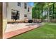 Wide backyard with patio, lawn, and mature trees. A great space for entertaining guests at 4000 Garfield Ct, Waxhaw, NC 28173