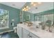 Bright bathroom with double sinks, vanity, large mirror, and ample natural light at 4000 Garfield Ct, Waxhaw, NC 28173