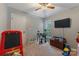 Bright bedroom with a ceiling fan, and lots of toys at 4000 Garfield Ct, Waxhaw, NC 28173
