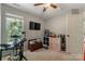 Bright bedroom with a ceiling fan, a drum set, and a TV at 4000 Garfield Ct, Waxhaw, NC 28173