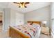 Cozy bedroom with a bed featuring a colorful quilt and large window for plenty of sunlight at 4000 Garfield Ct, Waxhaw, NC 28173