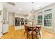 Cozy breakfast nook next to kitchen features hardwood floors, stainless steel appliances and bright windows at 4000 Garfield Ct, Waxhaw, NC 28173