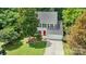 Aerial view of a two-story home with a red front door and manicured landscaping at 4000 Garfield Ct, Waxhaw, NC 28173