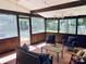 Screened-in patio with comfortable seating and views of the backyard at 4000 Garfield Ct, Waxhaw, NC 28173