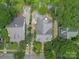 Aerial shot of houses in a neighborhood with mature trees and landscaping, providing a serene and private atmosphere at 412 Dale Ave, Gastonia, NC 28052