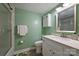 Well-maintained bathroom with vanity, enclosed shower, and ample lighting at 4736 Hedgemore Dr, Charlotte, NC 28209