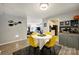 Bright dining area with views into the living room and kitchen, complete with seating for four at 4736 Hedgemore Dr, Charlotte, NC 28209