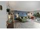 Open-concept living room with modern decor, stylish sofa, and large windows offering plenty of natural light at 4736 Hedgemore Dr, Charlotte, NC 28209