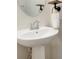 Close-up view of a pedestal sink in a bright, modern bathroom at 5008 Patton Dr, Gastonia, NC 28056