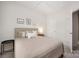 Well-lit bedroom with neutral tones, a queen bed, and modern furnishings at 5008 Patton Dr, Gastonia, NC 28056