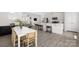 Open-concept space highlights the dining area that flows into the kitchen and living room creating a seamless living space at 5008 Patton Dr, Gastonia, NC 28056