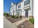 Charming townhome exterior with stone accents, dark shutters and tidy landscaping for curb appeal at 5008 Patton Dr, Gastonia, NC 28056