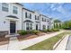Inviting townhome exterior with covered entry, stone accents and well maintained lawn at 5008 Patton Dr, Gastonia, NC 28056