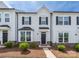 Charming townhome features light siding, dark shutters, manicured landscaping, and welcoming front entrance at 5008 Patton Dr, Gastonia, NC 28056