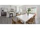 Bright, open kitchen boasts white cabinets, stainless steel appliances, and a large island with breakfast bar seating at 5008 Patton Dr, Gastonia, NC 28056