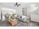 Bright living room with hardwood floors, plush sofa, and open floor plan at 5008 Patton Dr, Gastonia, NC 28056