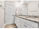 Bathroom with double sinks, granite countertops, and white cabinetry at 501 Preservation Dr, Fort Mill, SC 29715